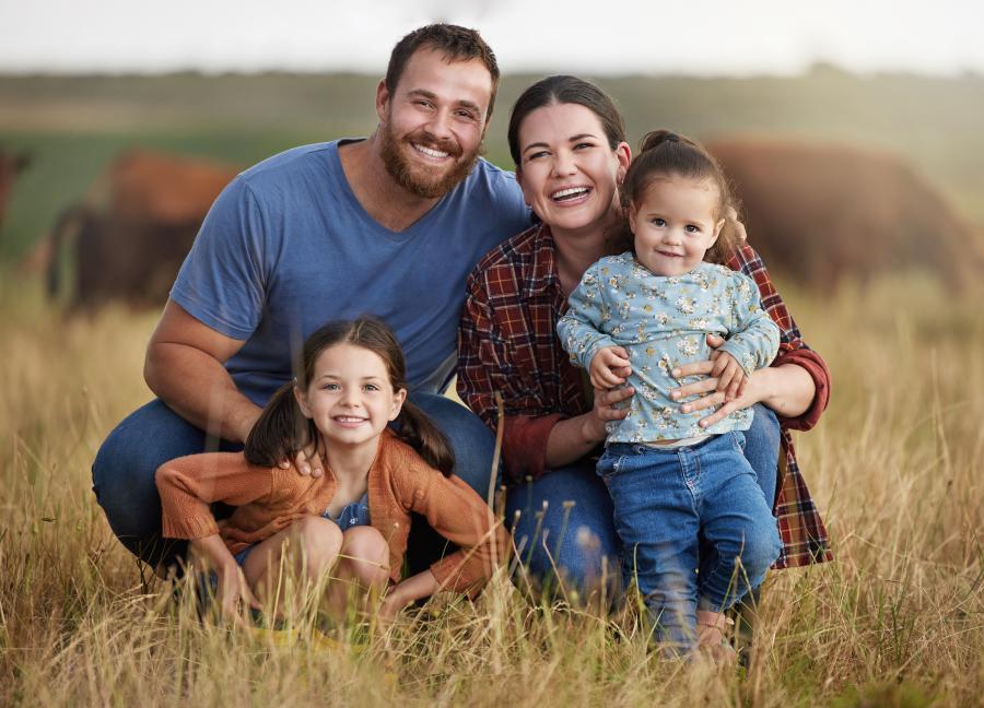 Portrait of young family in a field